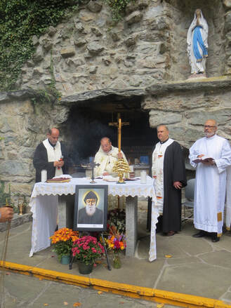 Four Maronite priests celebrating mass at the National Shrine Grotto in Maryland